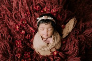 Newborn Sleeps Peacefully, Wrapped For Affordable Newborn Photography