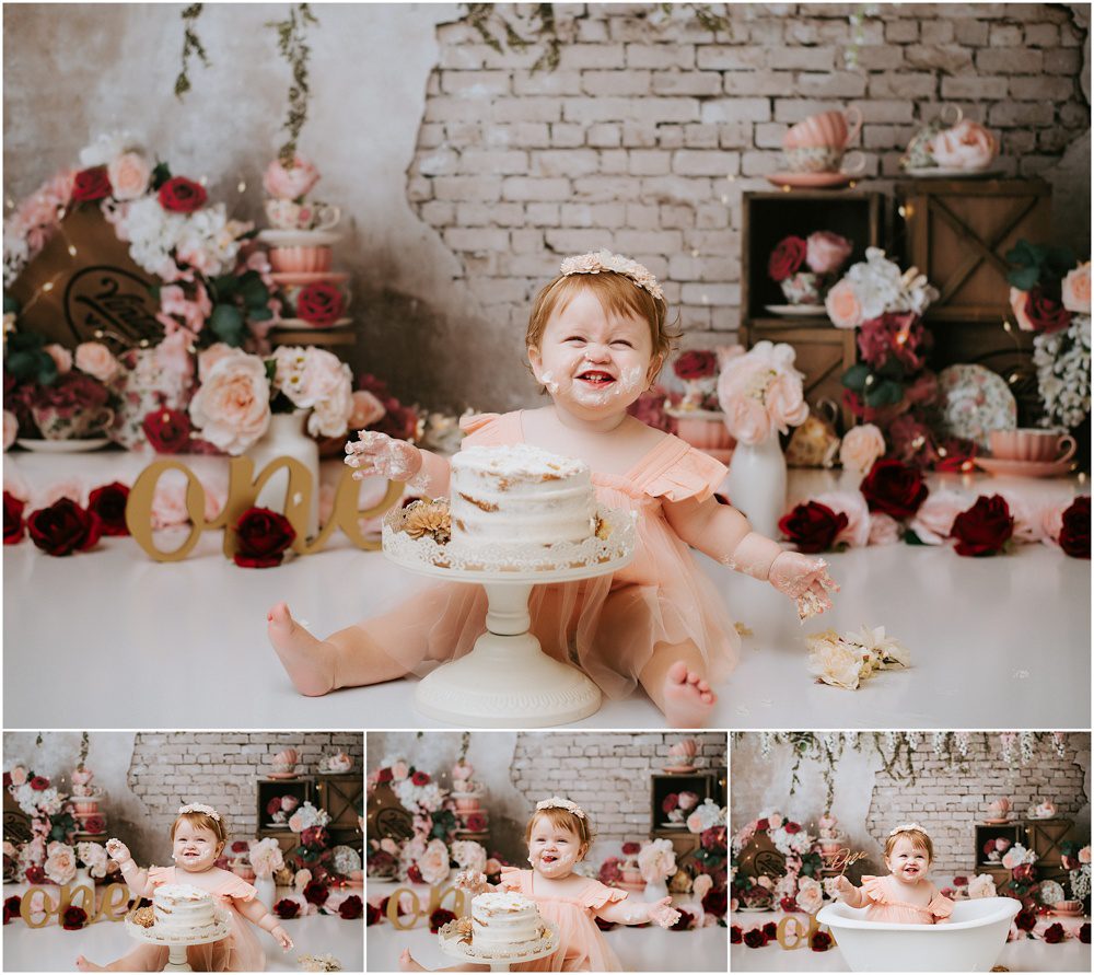 baby girl smiling at camera during her cake smash studio photo shoot session