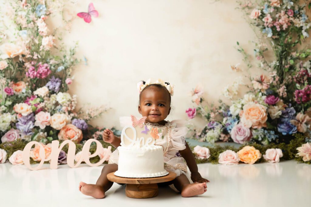 Cake Smash Theme Ideas For Your Baby'S First Birthday 12 Dallas Floral Butterfly Cake Smash Photography Featuring A Baby Girl In An Embroidered Dress Celebrating Her First Birthday With A Butterfly Cake, Floral Backdrop, And Elegant Garden-Inspired Theme