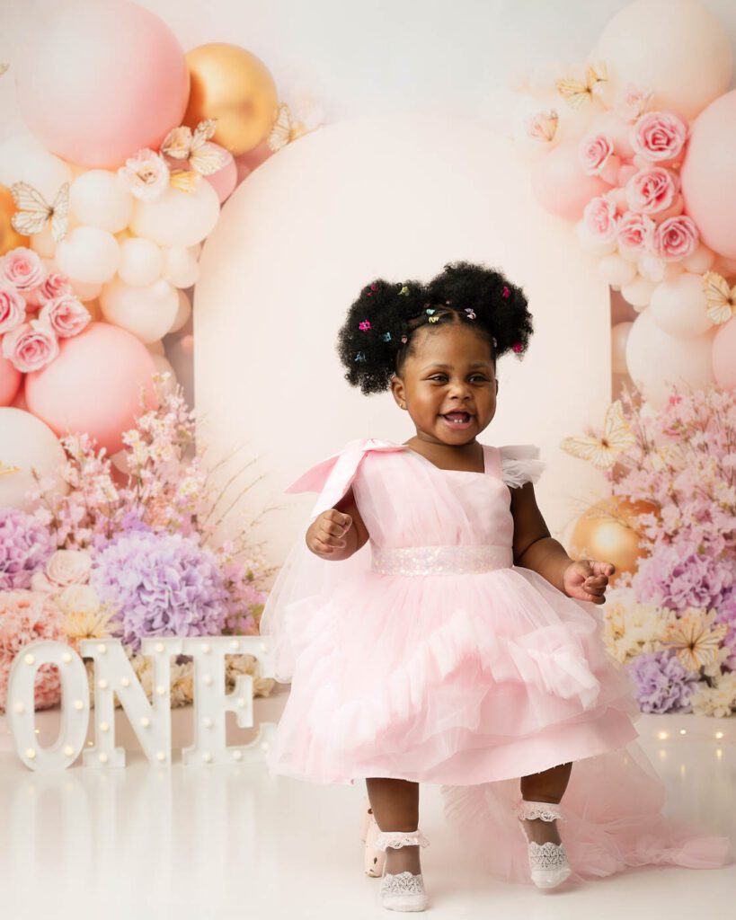 Dallas Moon And Stars Cake Smash Photography Featuring A Baby Boy With A Blue Birthday Cake, Crescent Moon Backdrop, Balloon Garland, And Celestial First Birthday Theme