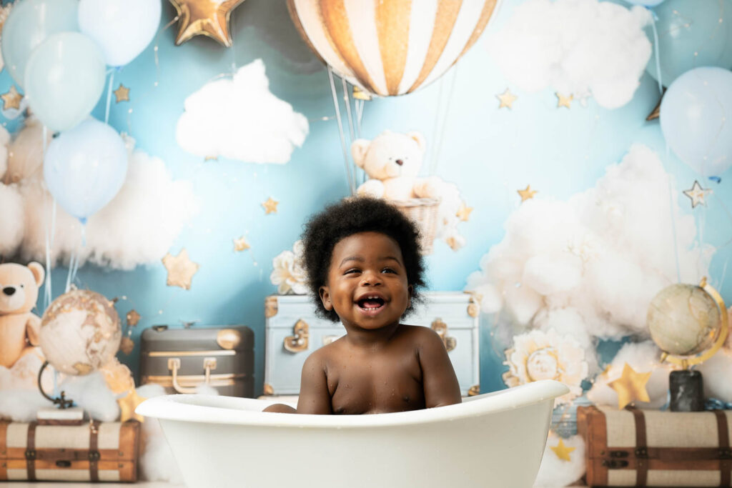 What Parents Don’t Expect During A Cake Smash Session 10 Cake Smash Milk Bath Session With Smiling Baby During First Birthday Portraits In Dallas