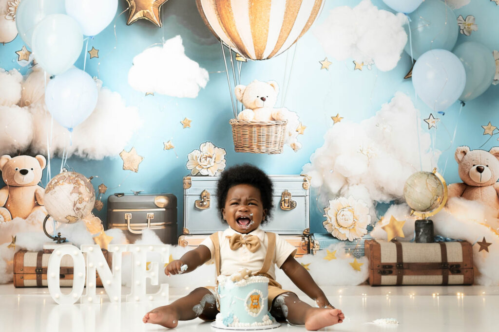 What Parents Don’t Expect During A Cake Smash Session 6 Baby Boy Cake Smash Session In Dallas With Blue Hot Air Balloon First Birthday Theme