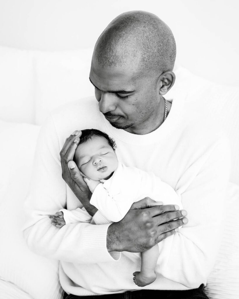 Black &Amp; White Newborn Photography In Dallas 13 Father Holding His Sleeping Newborn During A Black And White Newborn Photography Session.