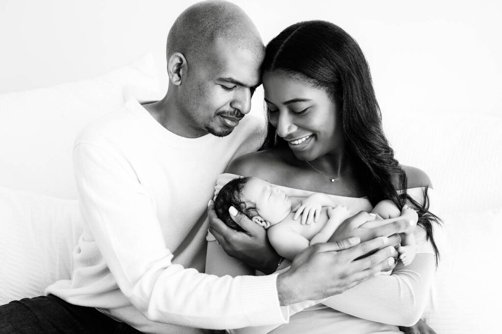 Black &Amp; White Newborn Photography In Dallas 19 Parents Holding Their Newborn Together During A Black And White Newborn Family Portrait In Dallas.
