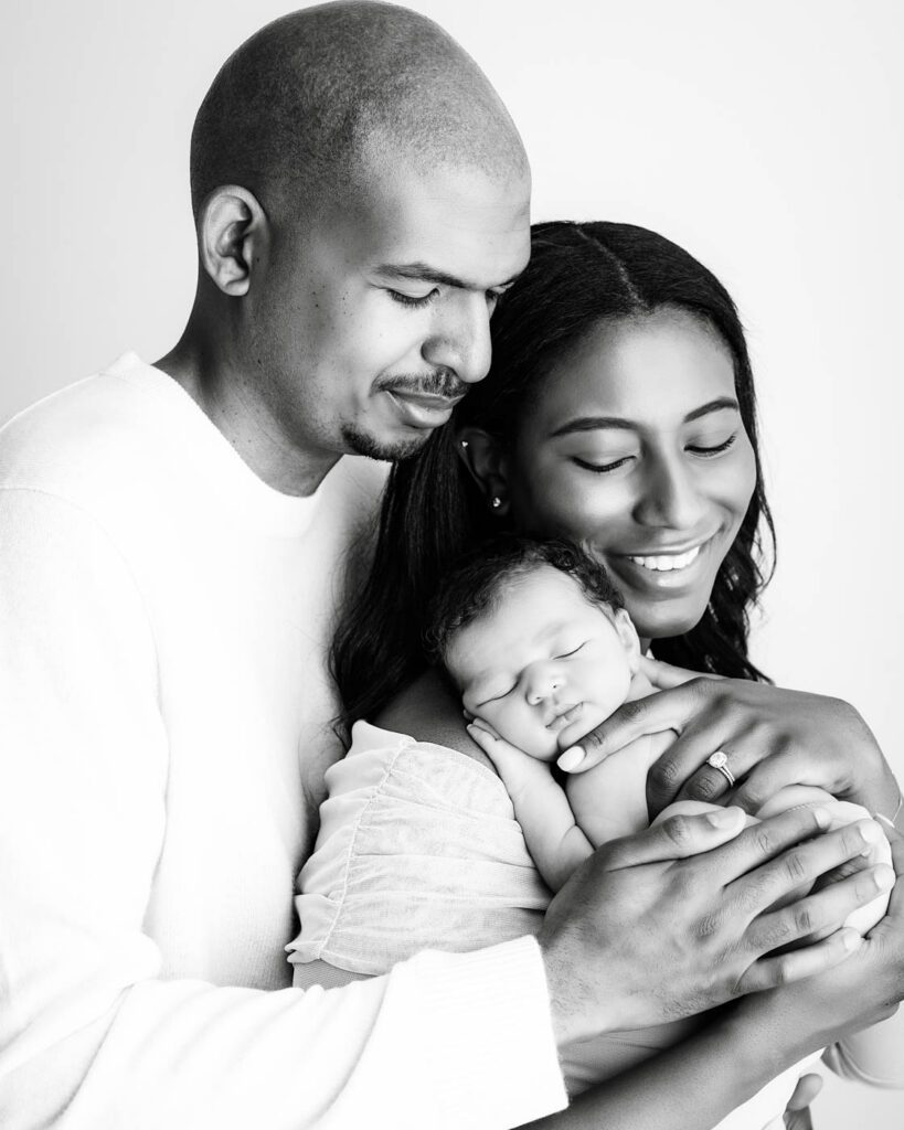 Black &Amp; White Newborn Photography In Dallas 21 Parents Holding Their Sleeping Newborn During A Luxury Black And White Newborn Photography Session In Dallas.