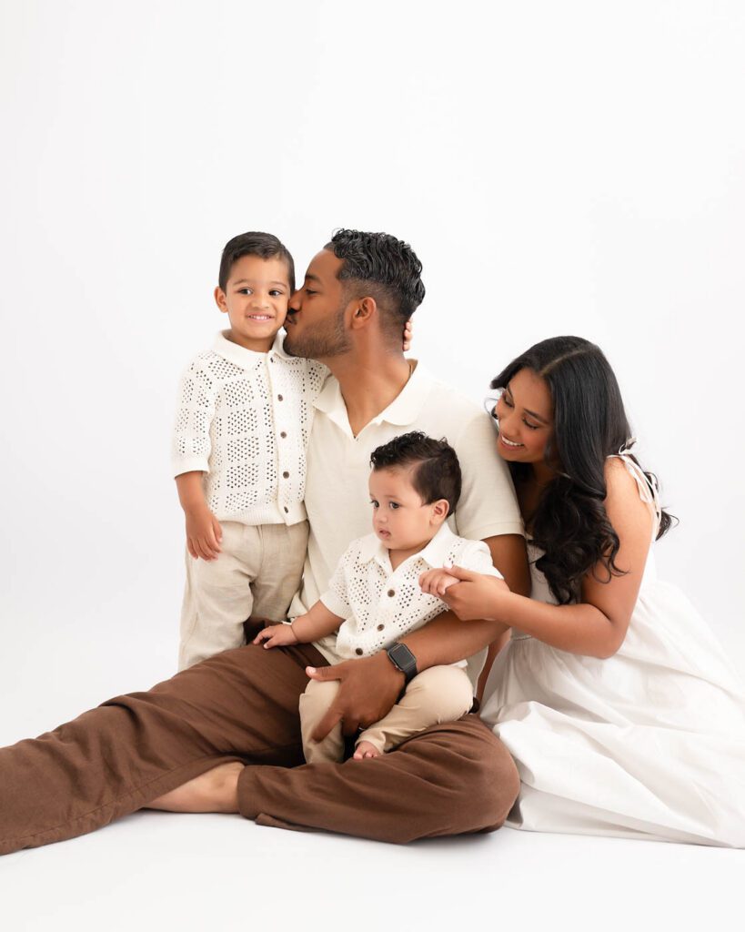 Why Include Siblings In Your Cake Smash Session? 19 Parents And Two Children Together Before A Professionally Styled Cake Smash Photography Session.