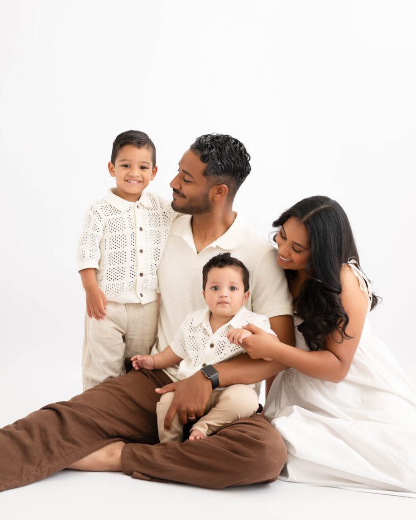 Why Include Siblings In Your Cake Smash Session? 12 Family Portrait Before A Siblings Cake Smash Session With Parents, Older Brother, And One-Year-Old Baby In A Dallas Photography Studio.