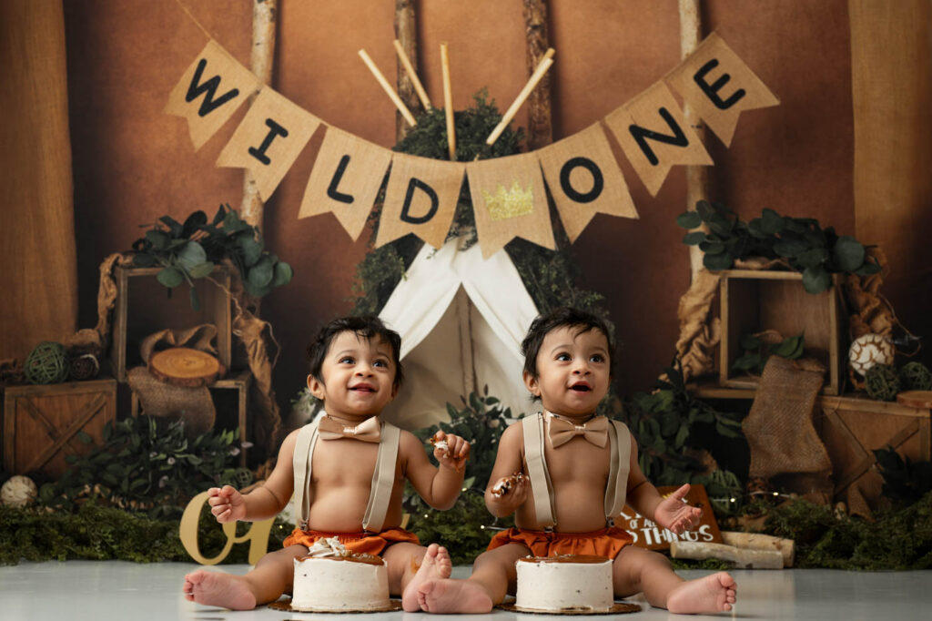 Cake Smash Photoshoot Tips For Including Siblings 10 Twin Babies Smiling During A Dallas Cake Smash Photoshoot With Themed Birthday Decor