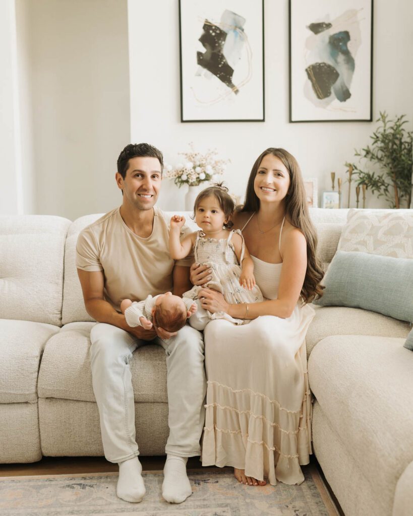 Postpartum Newborn Photography: Supporting New Parents Through A Calm, Thoughtful Experience 11 New Parents And Their Two Children During A Relaxed Postpartum Newborn Photography Session In Dallas.