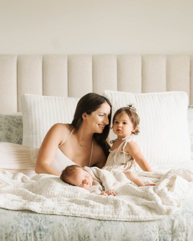 Postpartum Newborn Photography: Supporting New Parents Through A Calm, Thoughtful Experience 19 Mother Spending Time With Her Newborn And Toddler During A Postpartum Newborn Photography Session.