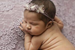 Newborn Rests On A Textured Lavender Blanket, Perfectly Capturing Editing Styles In Dallas Newborn Photography.