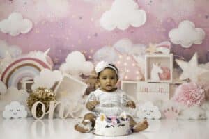 Baby Sits On A Unicorn-Themed Cake Smash Photoshoot With Cake Smash Photographer In Dallas | Lily Hayes Photography