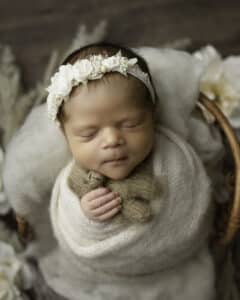 Newborn Holding A Tiny Teddy Bear While Sleeping | Pricing For Dallas Newborn Photography 