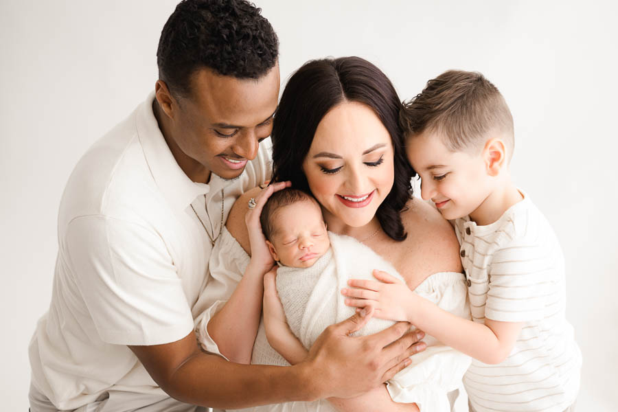 Booking A Dallas Newborn Photographer: What Every Parent Should Know 26 Family Newborn Photography Session With Parents And Sibling In Dallas Studio