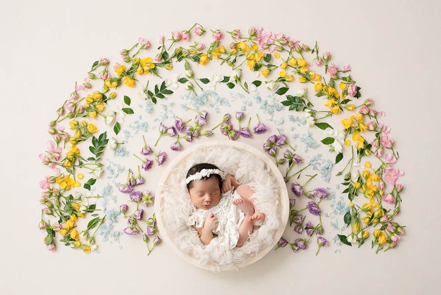 Booking A Dallas Newborn Photographer: What Every Parent Should Know 18 Fine Art Newborn Photography Portrait With Floral Rainbow Styling In Dallas Studio