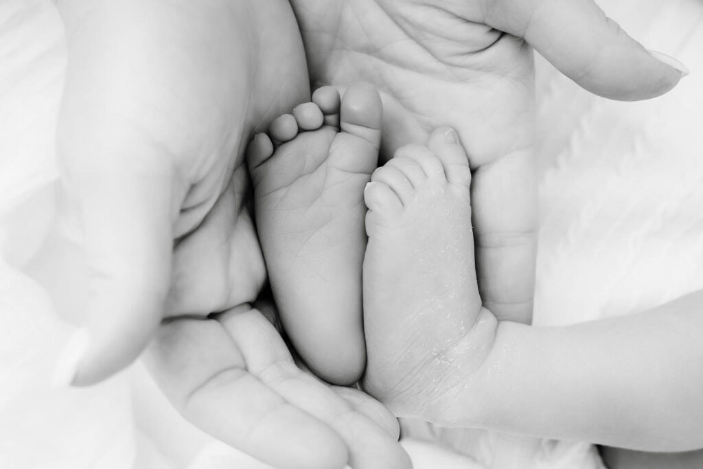 Close-Up Newborn Baby Feet Detail Portrait During Lifestyle Newborn Photography Session