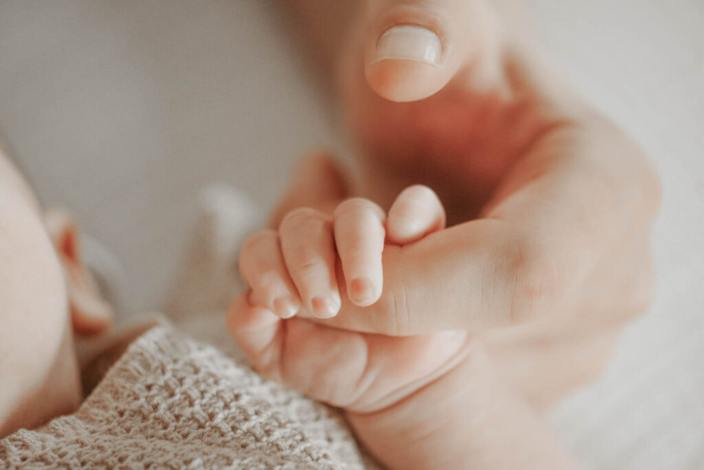 Closeup Of Newborn Hand During Lifestyle Newborn Photography Session