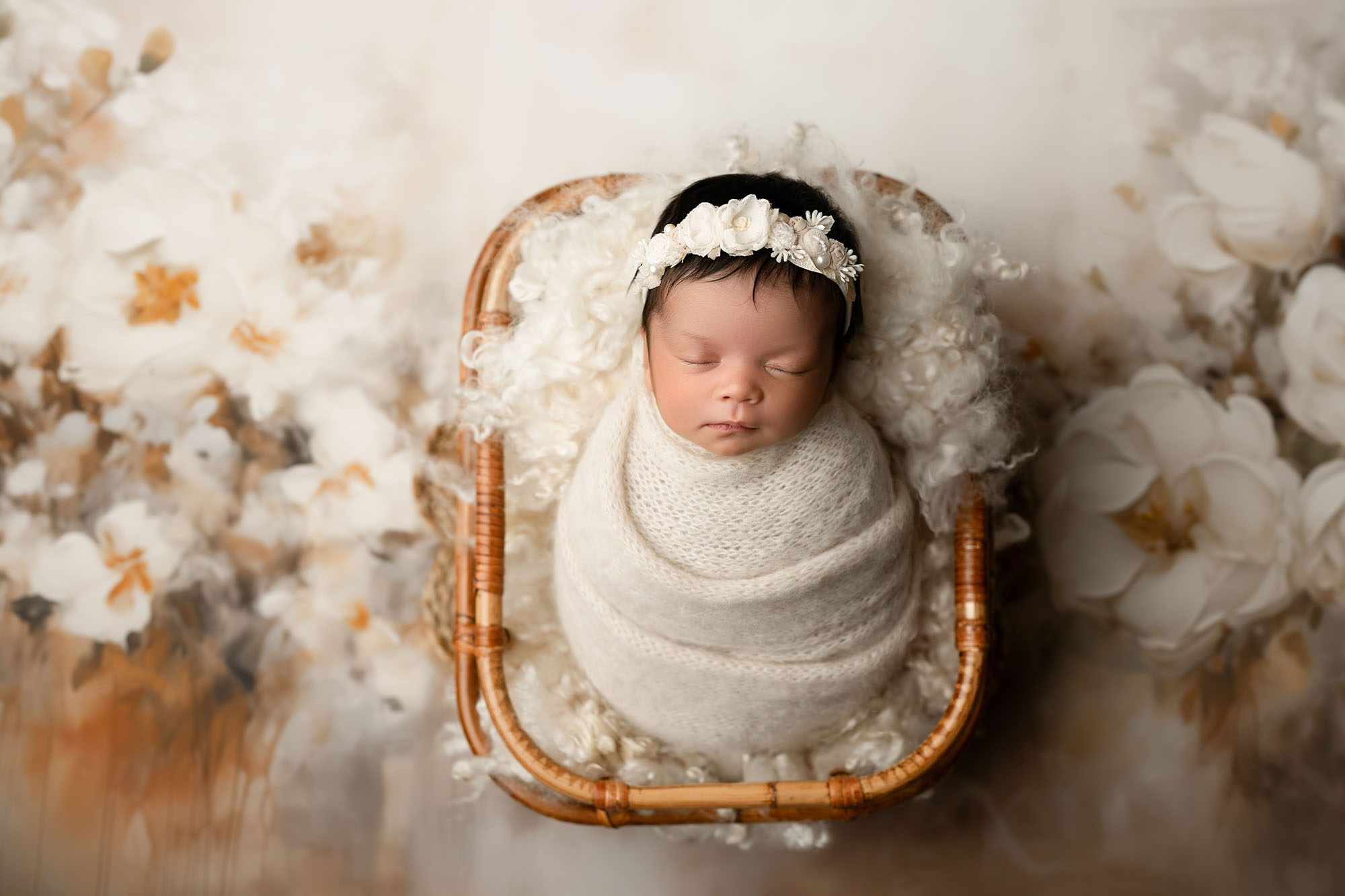 Dallas Newborn Photographer – Baby Girl Swaddled In Cream Blanket, Resting In A Wicker Basket With Flowers