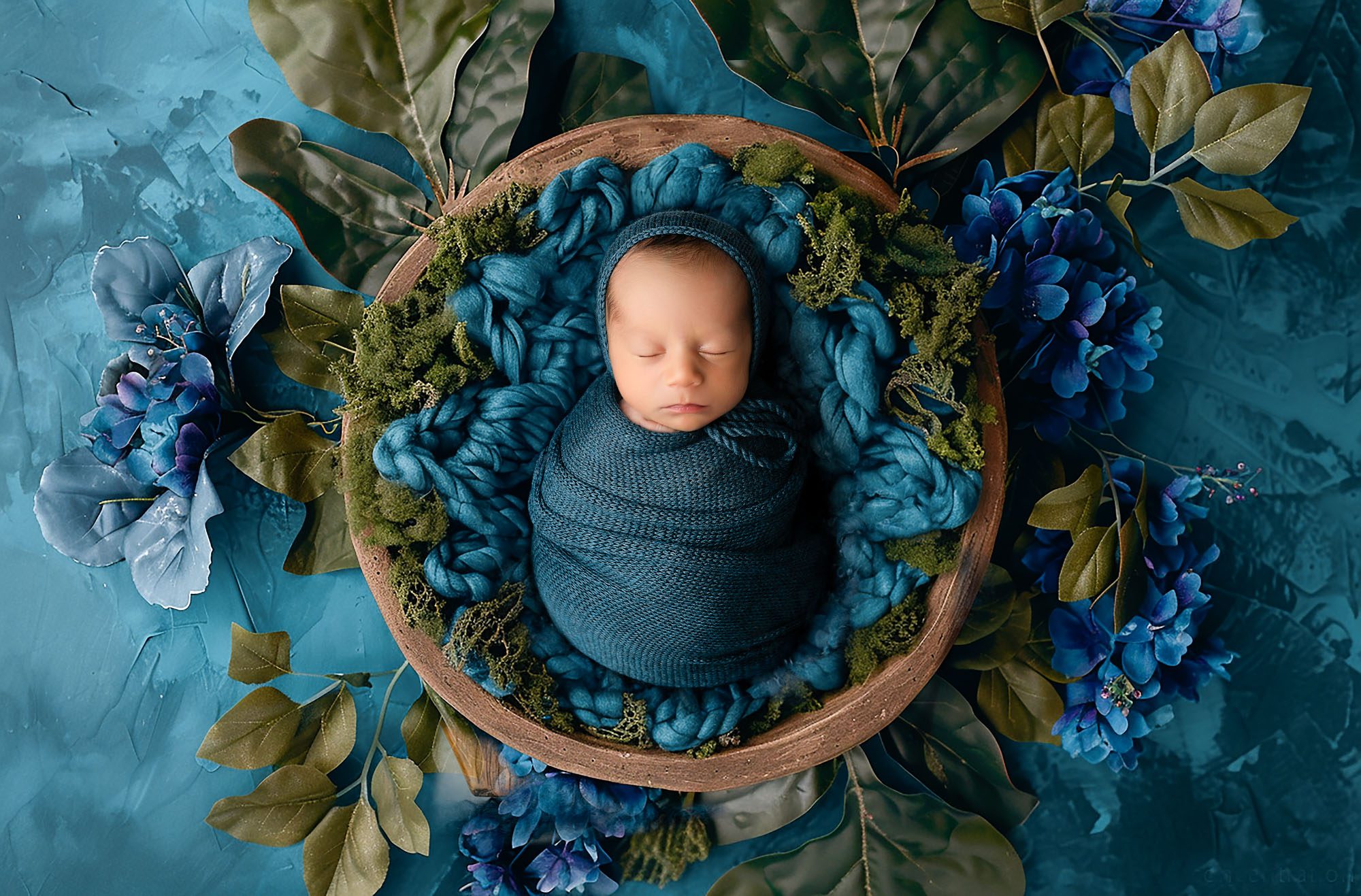 Newborn Photos Color Scheme | Exploring Different Options 1 Newborn Photos Of Sleeping Newborn Wrapped In Teal Blanket In Floral Nest | Dallas Newborn Photographer