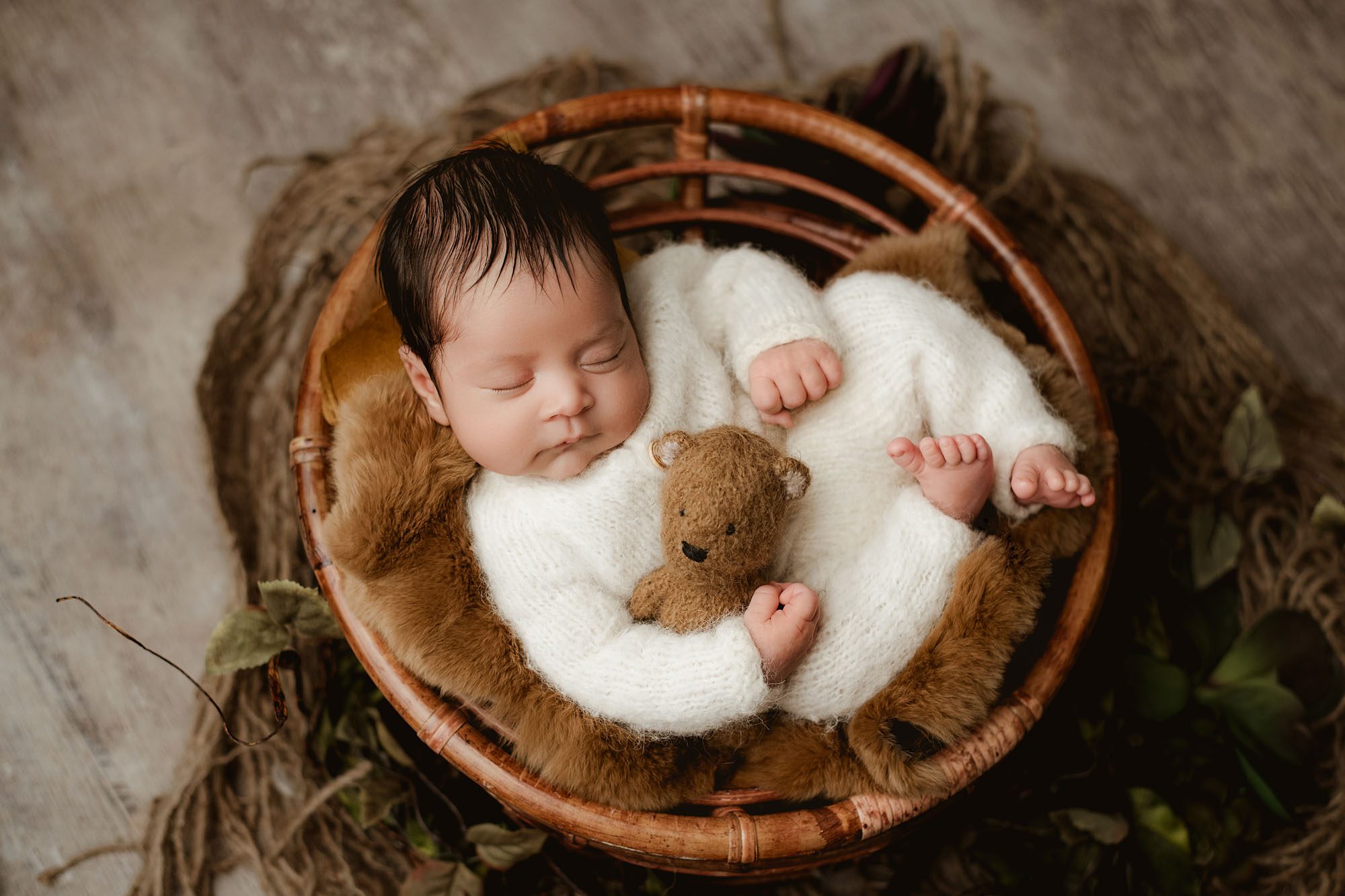 Newborn Baby In A Wicker Basket, Wearing A White Outfit And Holding A Teddy Bear – Dallas Baby Photography