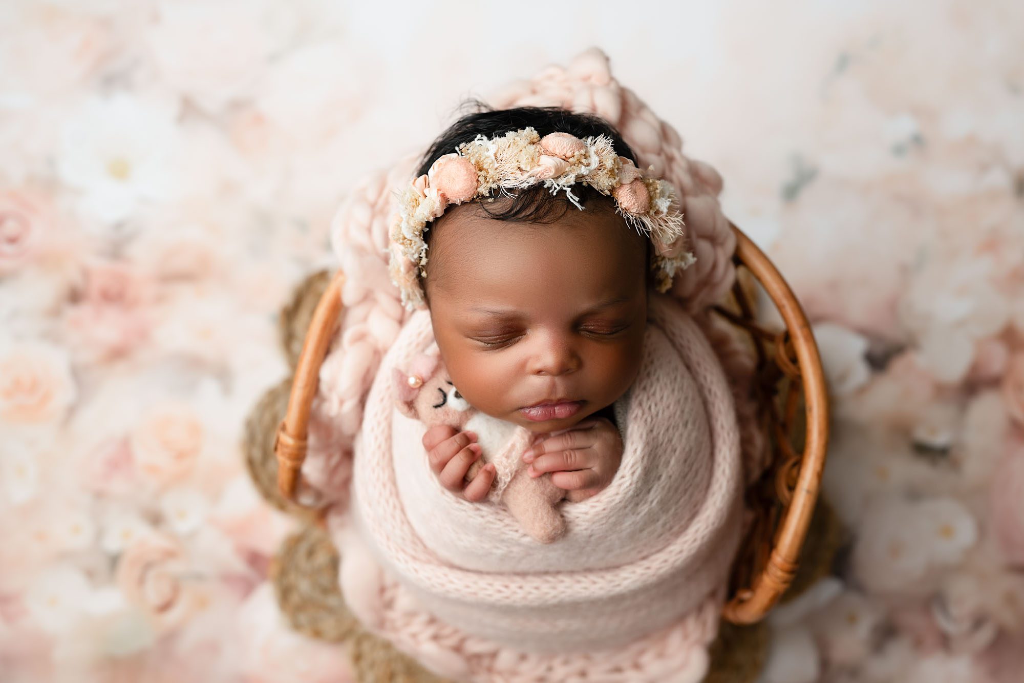 What To Wear To A Newborn Shoot? 1 Dallas Newborn Photographer Captures Baby Girl Holding Tiny Teddy Bear While Swaddled In Pink