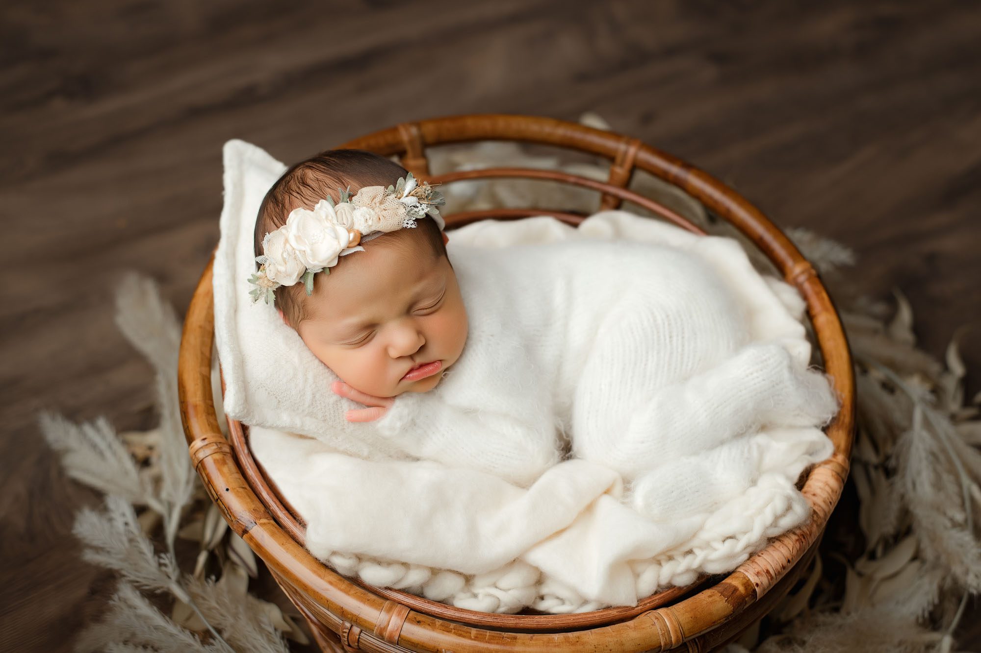Newborn Baby Girl In Cozy White Outfit Lying On Blanket In Basket – Dallas Baby Photographer
