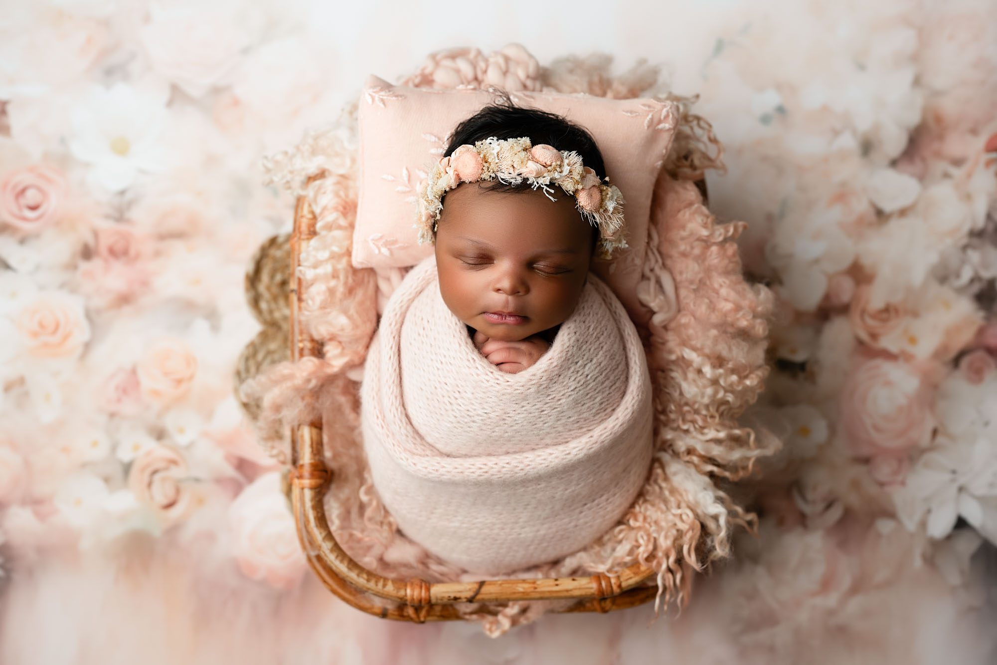Newborn Baby Girl Wrapped In Soft Pink Blanket With Floral Headband, Photographed By Dallas Newborn Photographer