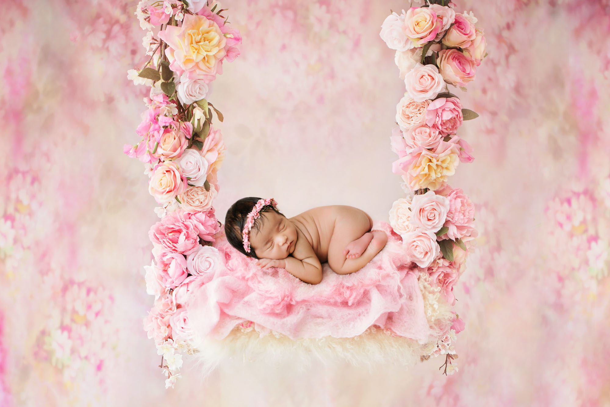 Newborn Photography In Dallas Featuring Baby Girl On Pink Floral Swing Backdrop