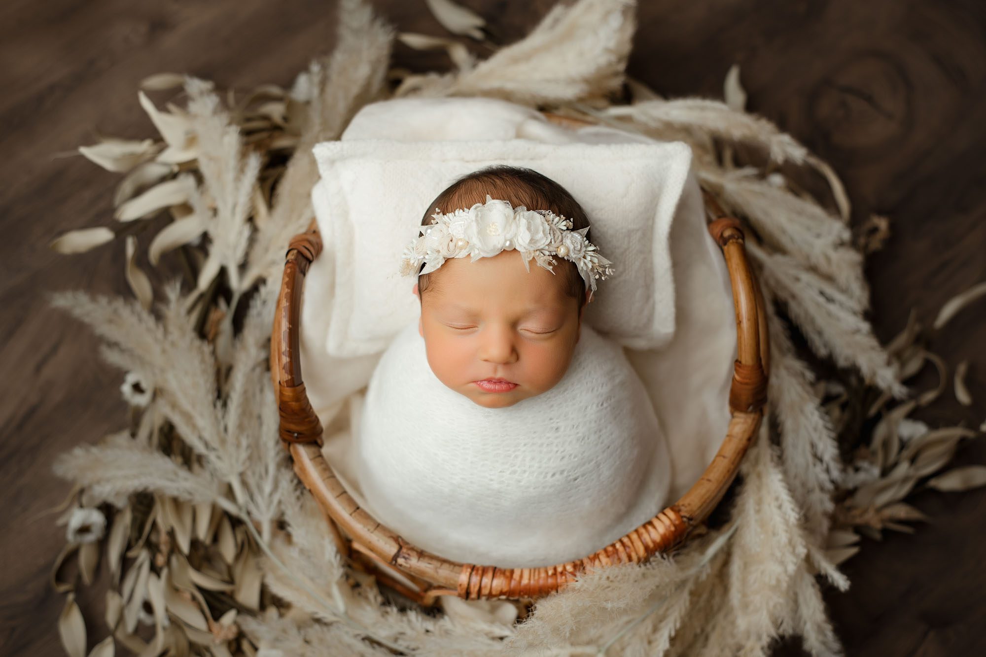 Newborn Baby Girl Wrapped In White Blanket With Floral Headband In A Basket – Dallas Newborn Photography