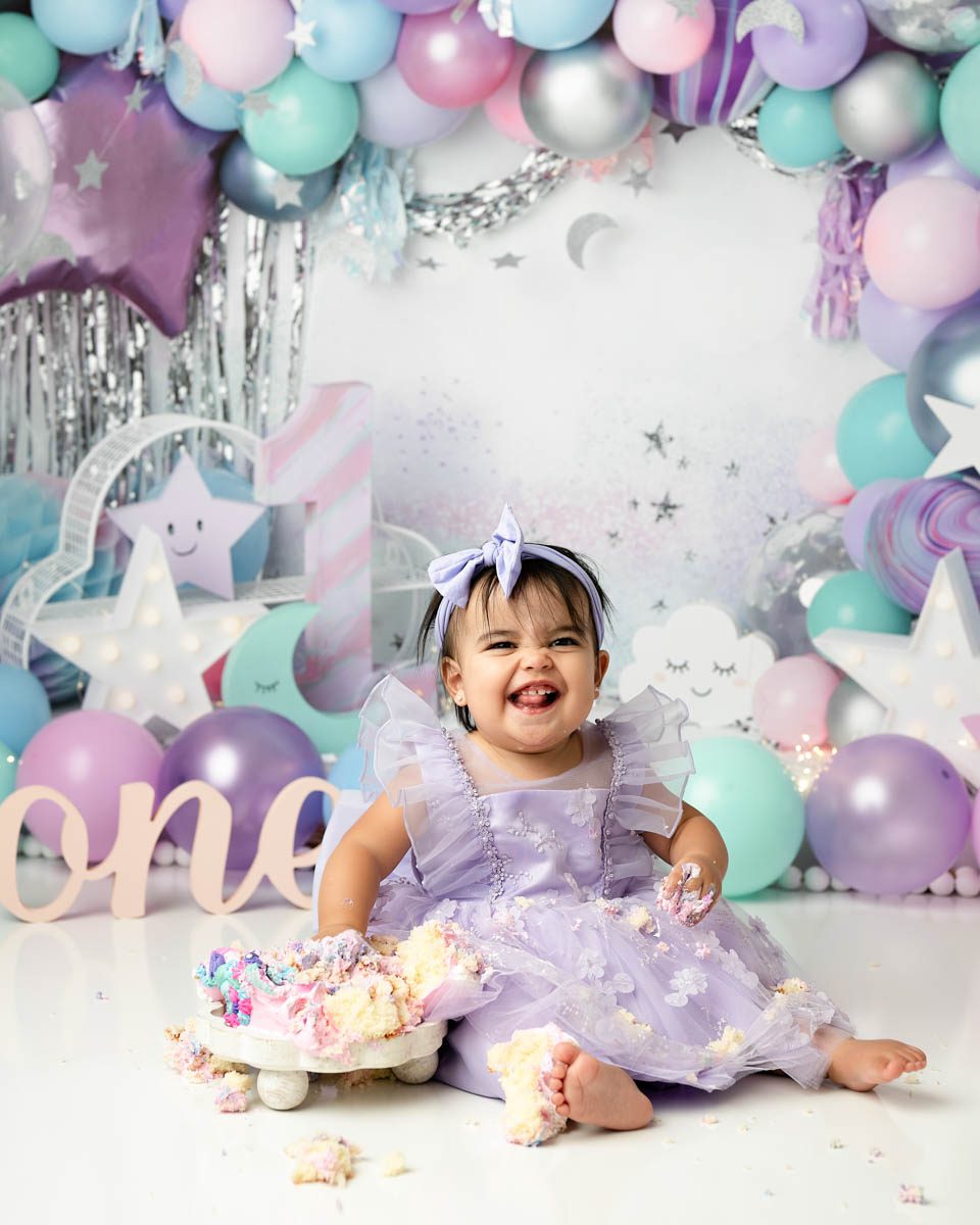 First birthday cake smash session with pastel theme by Dallas cake smash photographer Lily Hayes