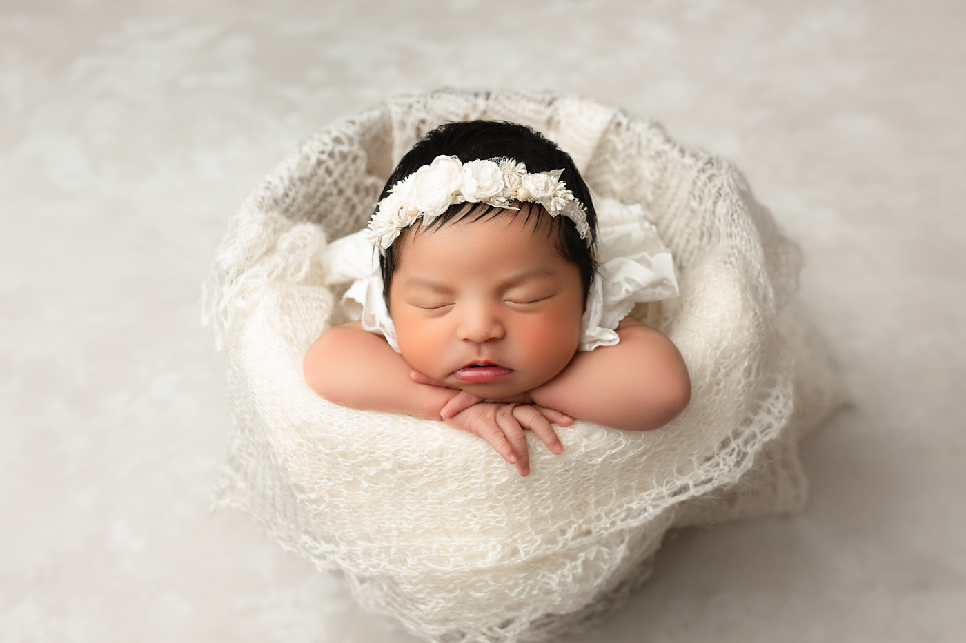 Dallas Newborn Photographer Captures Newborn Photo Of Baby In Chin Pose On Soft Blanket With Neutral Styling