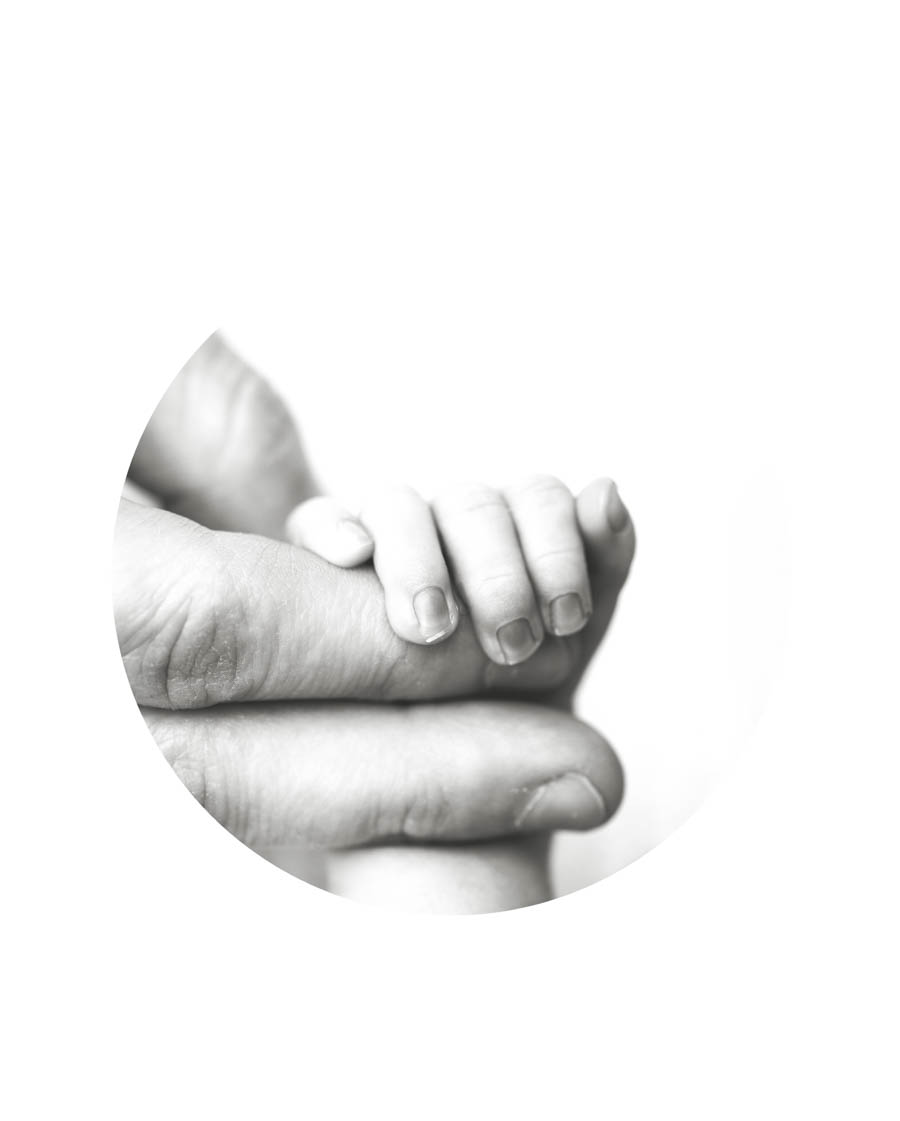 Newborn baby holding parent finger in a black and white detail photo in Rockwall Texas