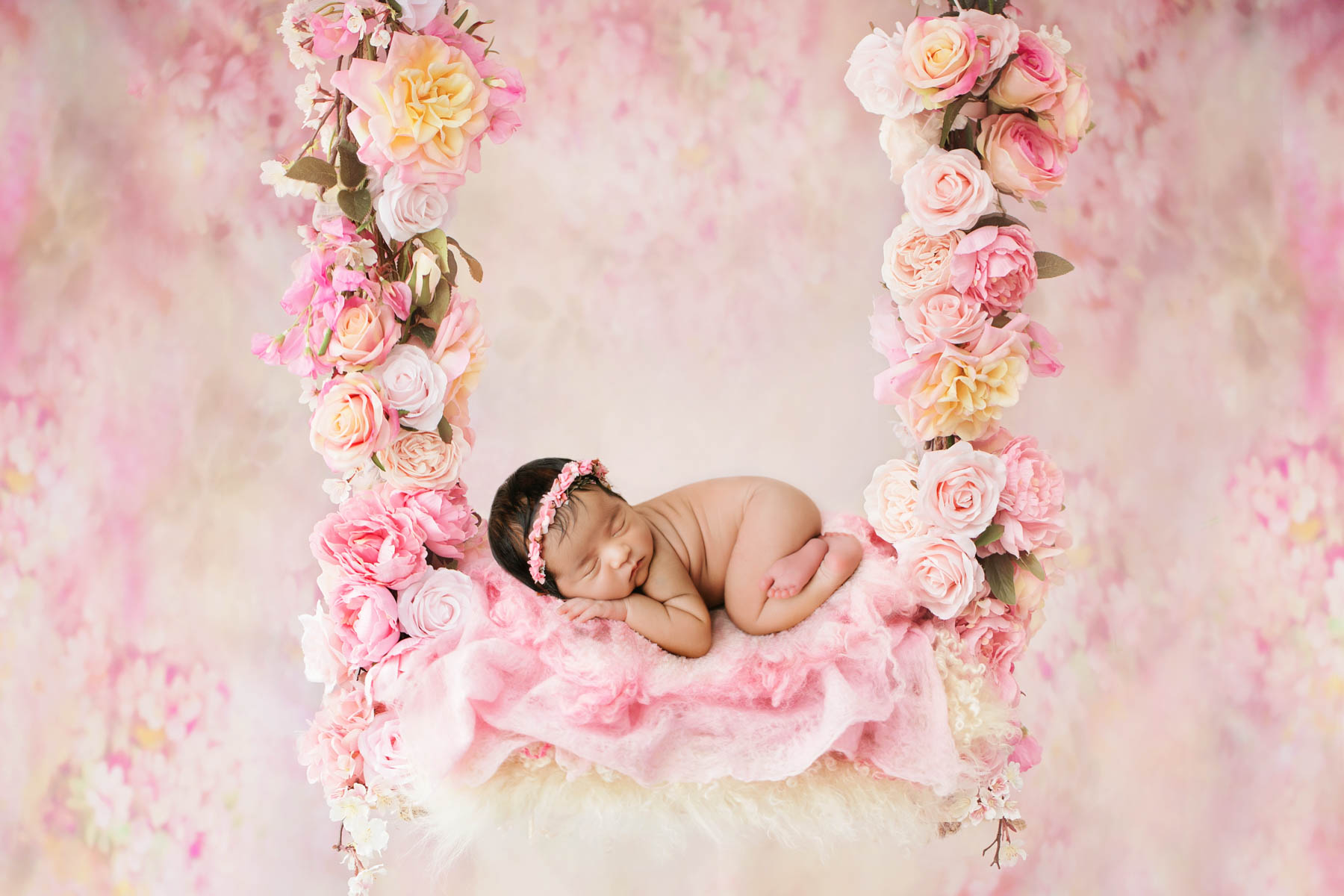 Affordable Newborn Photography: Seizing The Cherished Moments 4 Dallas Newborn Photography Session With Baby Girl Posed On Soft Pink Floral Swing