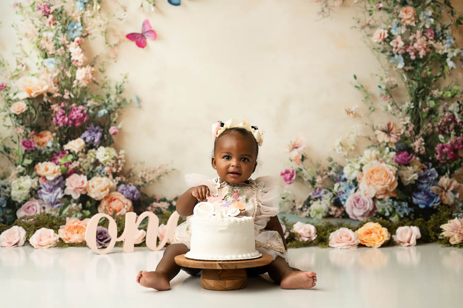 Floral Cake Smash Portraits For Baby Girl In Dallas Studio