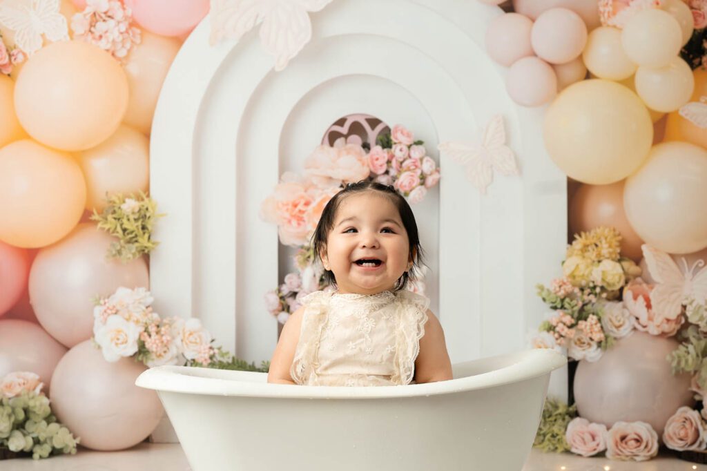 Smiling Baby Girl During Milk Bath Portion Of A Dallas Cake Smash Photography Session