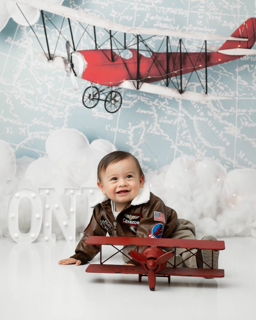Vintage Airplane First Birthday Session Photographed By A Cake Smash Photographer In Dallas
