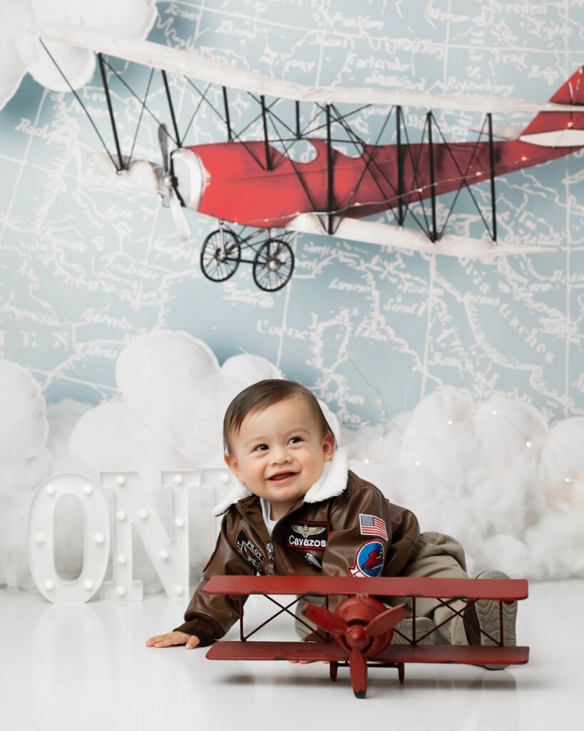 Airplane-Themed First Birthday Cake Smash Photography In Dallas.