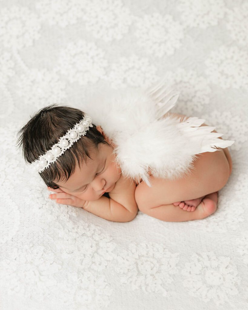 What Happens If My Baby Won’t Sleep During A Newborn Session? 17 Sleeping Newborn Baby Girl With Angel Wings Photographed By A Luxury Newborn Photographer In Dallas
