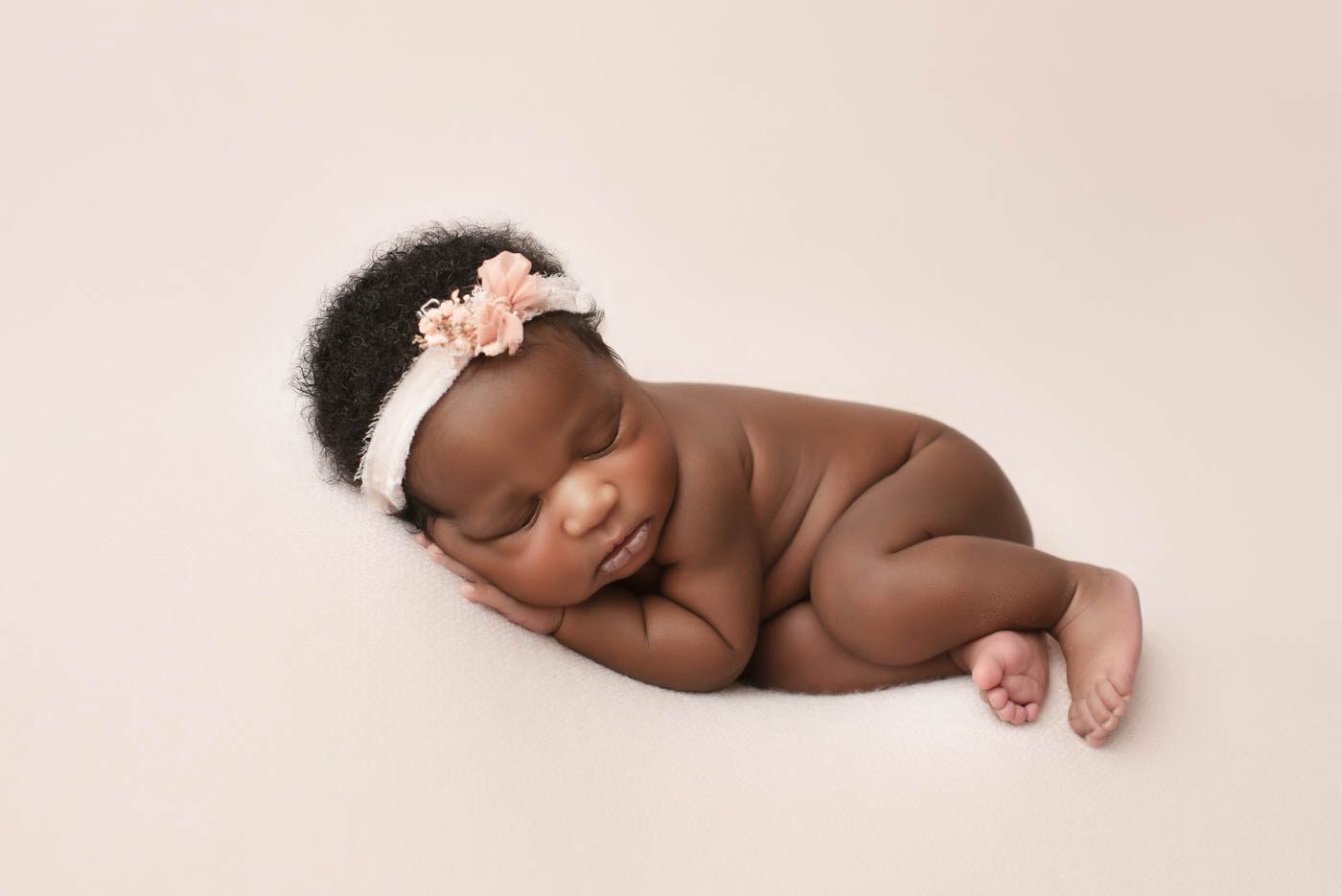 Dallas newborn photographer creating a classic newborn pose that's perfect for birth announcements and baby keepsakes.
