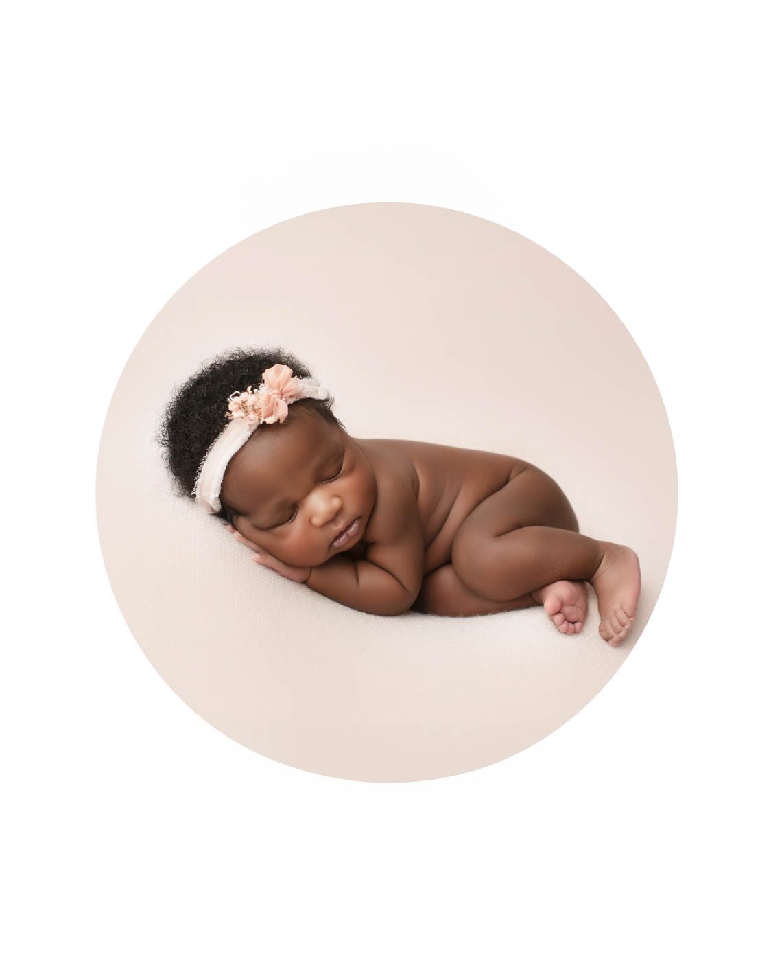 Fine art newborn photographer Dallas creating a timeless portrait of a sleeping baby girl in a classic newborn pose on a soft neutral backdrop.